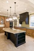 image of opulence  - opulent kitchen with complimentary colored cabinets and granite island - JPG 