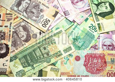 Picture or Photo of Mexican Currency bills and coins. Isolated on white