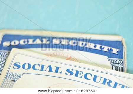 Picture or Photo of Closeup of US Social Security cards on blue