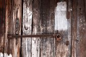 image of latch  - Old latch with padlock on wooden doors - JPG 