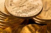 picture of currency  - Stacks of gold eagle one troy ounce golden coins from US Treasury mint - JPG 