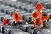 stock photo of computer  - Small figurines of workers repairing computer keyboard - JPG 