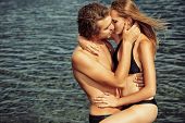 picture of holidays  - Beautiful young couple in love  having holidays on the sea - JPG 
