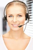 image of helpline  - picture of friendly female helpline operator with headphones - JPG 