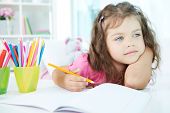 image of people  - Portrait of lovely girl drawing with colorful pencils - JPG 
