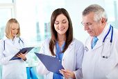 picture of medical doctors  - Portrait of successful medical workers discussing plan in hospital - JPG 