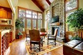 pic of interior  - Luxury mountain home diining and living room with stone fireplace - JPG 