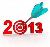 image of on target  - The year 2013 with an arrow in a bullseye target inside the number to symbolize targeted goals for the new year - JPG 