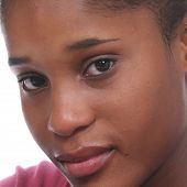 stock photo of africanamerican  - attractive close up of african american teen girl with clear skin and engaging eyes - JPG 