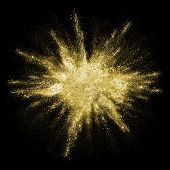 Gold powder particles explosion. Glitter burst with golden texture. Golden color dust splash for fas