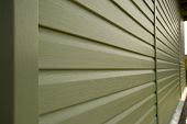 pic of buildings  - Siding wall of building in perspective closeup in the daytime outdoors - JPG 