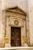 picture of portal  - a beautiful wooden portal of a church in south italy - JPG 