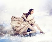 foto of animals  - Fashion Beautiful Winter Woman in Luxury Fur Mink Coat - JPG 