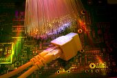stock photo of isp  - network cables and hub closeup with fiber optical backgroun - JPG 