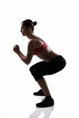image of sports  - sport girl doing squatting exercise - JPG 
