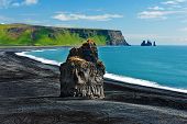 pic of beach  - Beautiful rock formation on a black volcanic beach at Cape Dyrholaey - JPG 