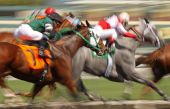 stock photo of horse  - Slow shutter speed rendering of racing horses and jockeys - JPG 