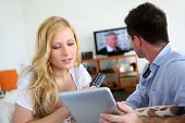 picture of internet  - Young couple choosing tv program on internet - JPG 
