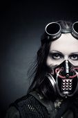 foto of security  - Portrait of post apocalyptic girl in gas mask over dark background - JPG 