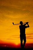 image of golfer  - golfers at sunset - JPG 