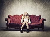 foto of interior  - Rich elegant woman sitting on a velvet antique sofa - JPG 