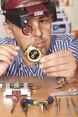 image of watch  - Watch repair craftsman repairing watch - JPG 