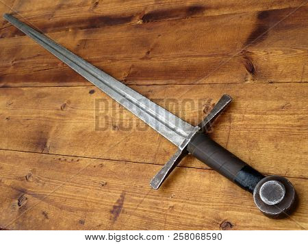 Poster: Old Medieval Sword On A