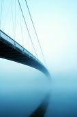 image of bridge  - Suspension bridge in fog - JPG 