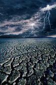 stock photo of discharge  - Cracked land and the lightning bolts - JPG 
