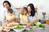 stock photo of family  - Positive family preparing lunch together in the kitchen - JPG 