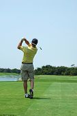 pic of golf  - Golfer in the after swing in a golf resort - JPG 
