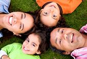 picture of family  - happy family portrait outdoors where they all look happy and smiling - JPG 