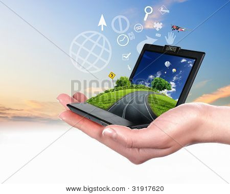 Picture or Photo of Human hand holding a green landscape