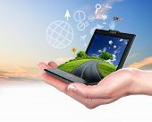 stock photo of business concept  - Human hand holding a green landscape - JPG 