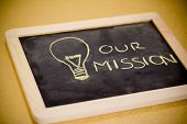 picture of business concept  - lighbulb and business mission chalk design on blackboard - JPG 