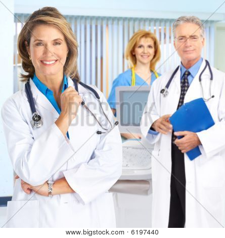 Picture or Photo of Smiling medical people with stethoscopes. Doctors and nurses