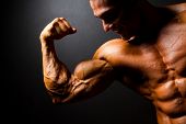 foto of six  - strong bodybuilder posing on black background - JPG 
