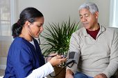 stock photo of health  - Home health care worker and an elderly couple - JPG 