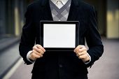 stock photo of man  - Businessman holding digital tablet pc with blank screen - JPG 