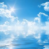 stock photo of blue sky  - An illustration of a blue sky reflection on the water - JPG 