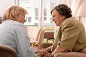 pic of home  - Senior woman is visited  by her doctor or caregiver at home - JPG 
