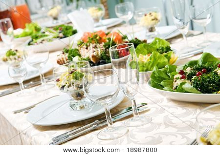 Picture or Photo of Catering table set service with silverware and glass stemware at restaurant before party
