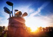 pic of objects  - Professional golf gear on the golf course at sunset - JPG 