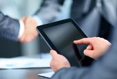 foto of handshake  - Businessman holding digital tablet - JPG 