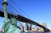 stock photo of bridge  - Brooklyn Bridge and The Statue of Liberty at Night - JPG 